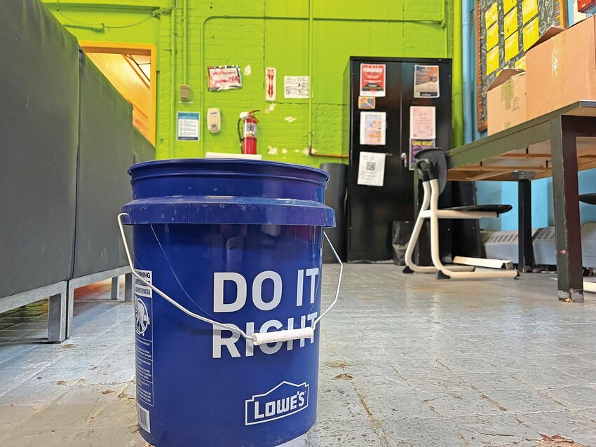 A bucket placed to catch water from a leaky ceiling at the Kingsbridge Heights Community Center on Thursday, April 18. The center recently secured $1 million in federal money for roof repairs, which may bring an end to water leaks in classrooms and offices.