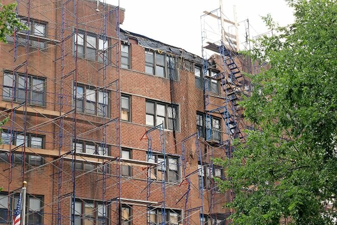 The crumbled exterior of 666 Kappock St. remains unrestored as of June 16.