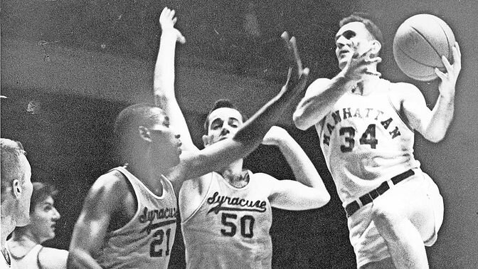 Jack Powers &rsquo;58, a Manhattan University legend, pictured scoring over Syracuse during his years playing on the Manhattan men&rsquo;s basketball team.