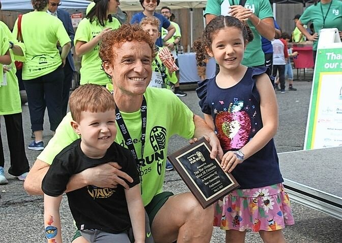 Crowned the fastest male and overall runner, Corey Levin celebrated his win with his six-year-old daughter, Violet, and his four-year-old, Charlie.