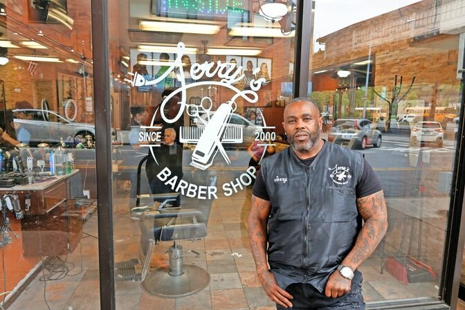 Jerry Lewis stands in front of his barbershop on 242nd Street. He moved to the new location in 2017, but has served the community for 25 years.