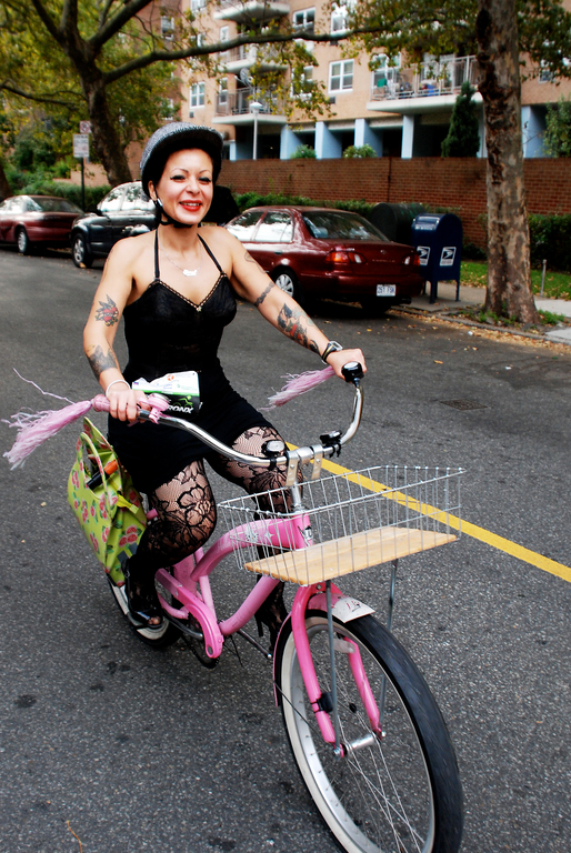 Sheryl Yvette, whose father Tom lives in Riverdale, riding along Riverdale Ave. on her pink Hello Kitty bicycle and wearing black heels