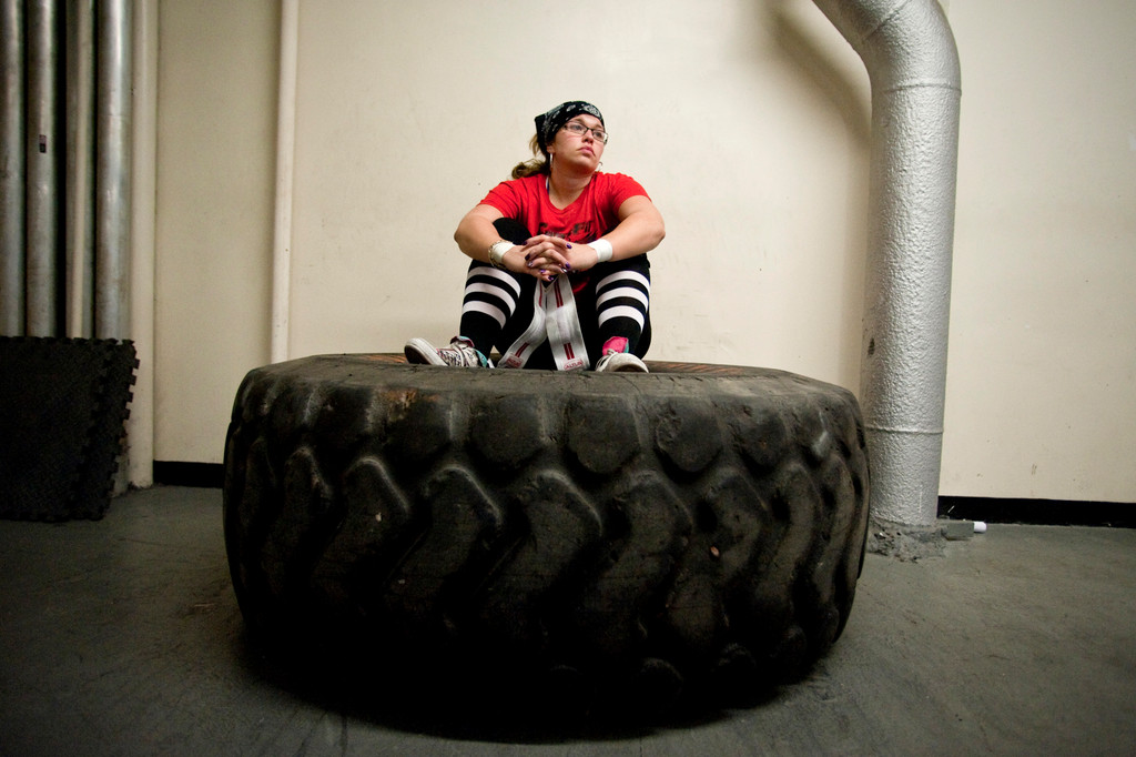 Alexandra Dante sits in a giant tire as she awaits the start of the final contest--a 445 lb weight pull.