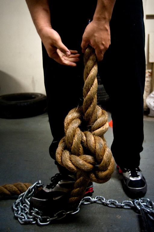 William Ortiz prepares the the massive rope used in the weight pull competition.