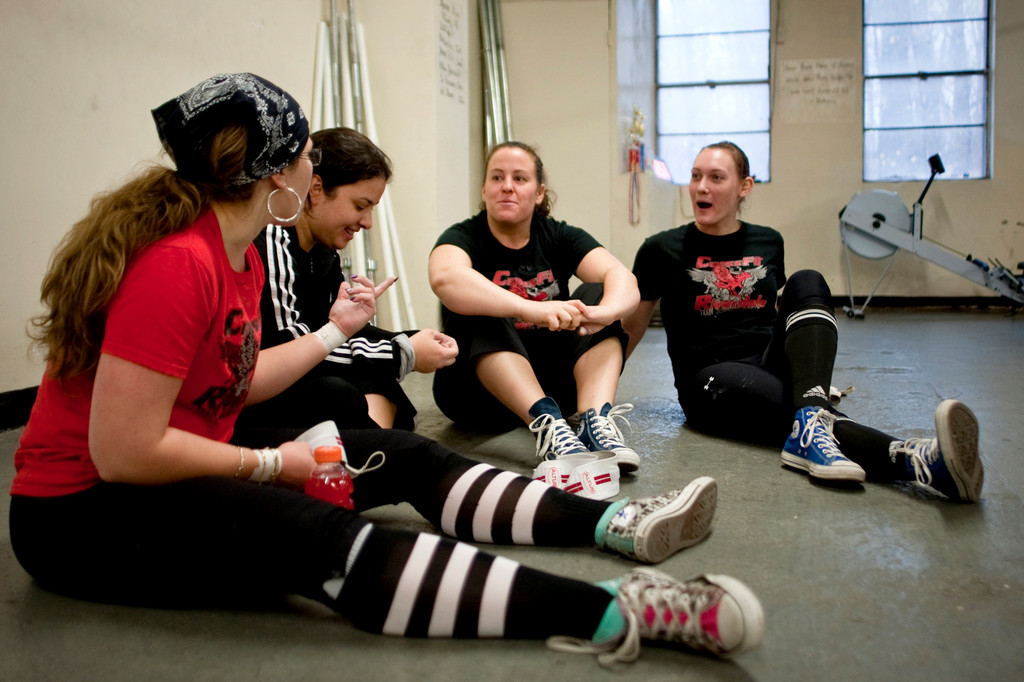 Strongest woman competitors, from left to right, Alexandra Dante, Andrea Nieves, Celestine Calpin and Samantha Sherwood chat as they catch their breaths between competitions.