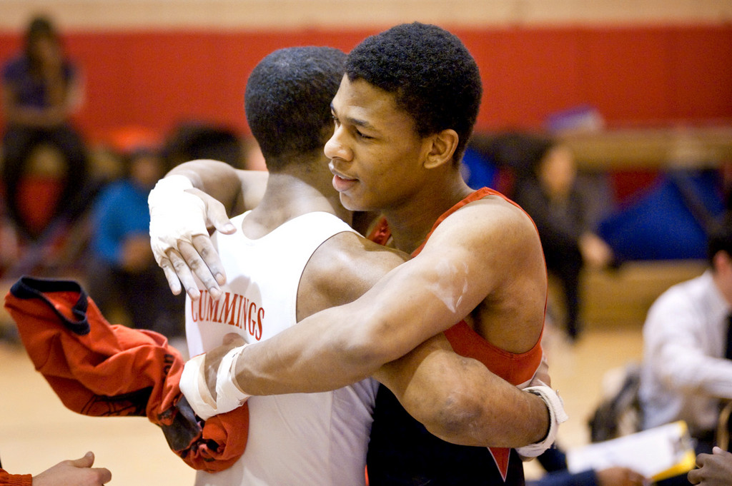 The John F. Kennedy Knights' boys gymnastics team faced off against local rival DeWitt Clinton on Jan. 6, defeating the Governors 130.35-94.1. V'Dal, at left, and Christopher embrace after the meet.