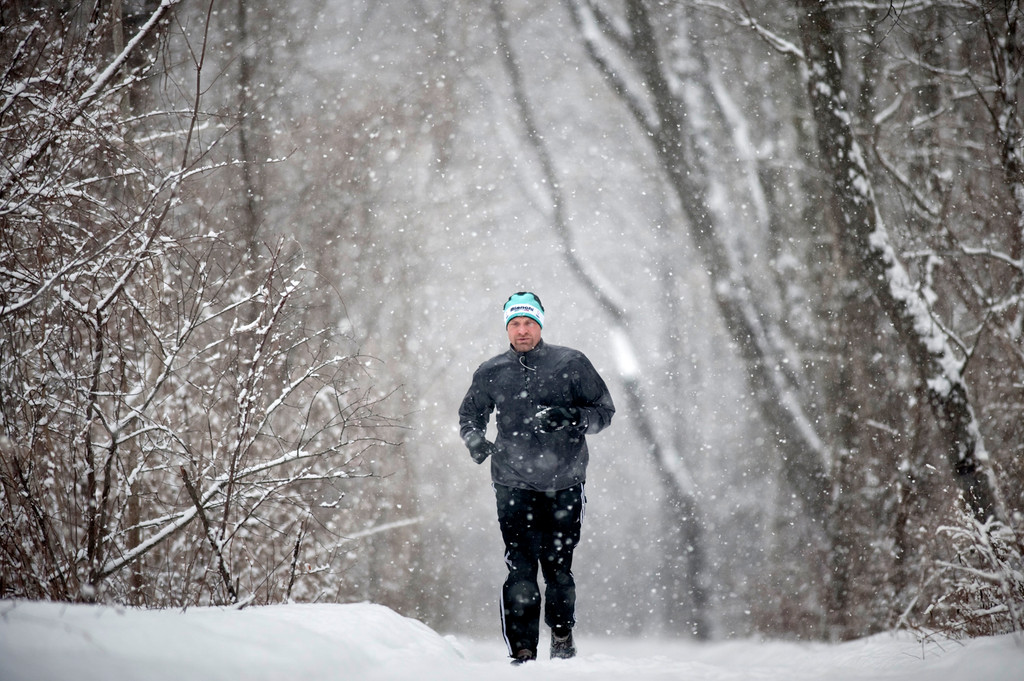 A man jogs through a snowy Van Cortlandt Park on Jan. 25.