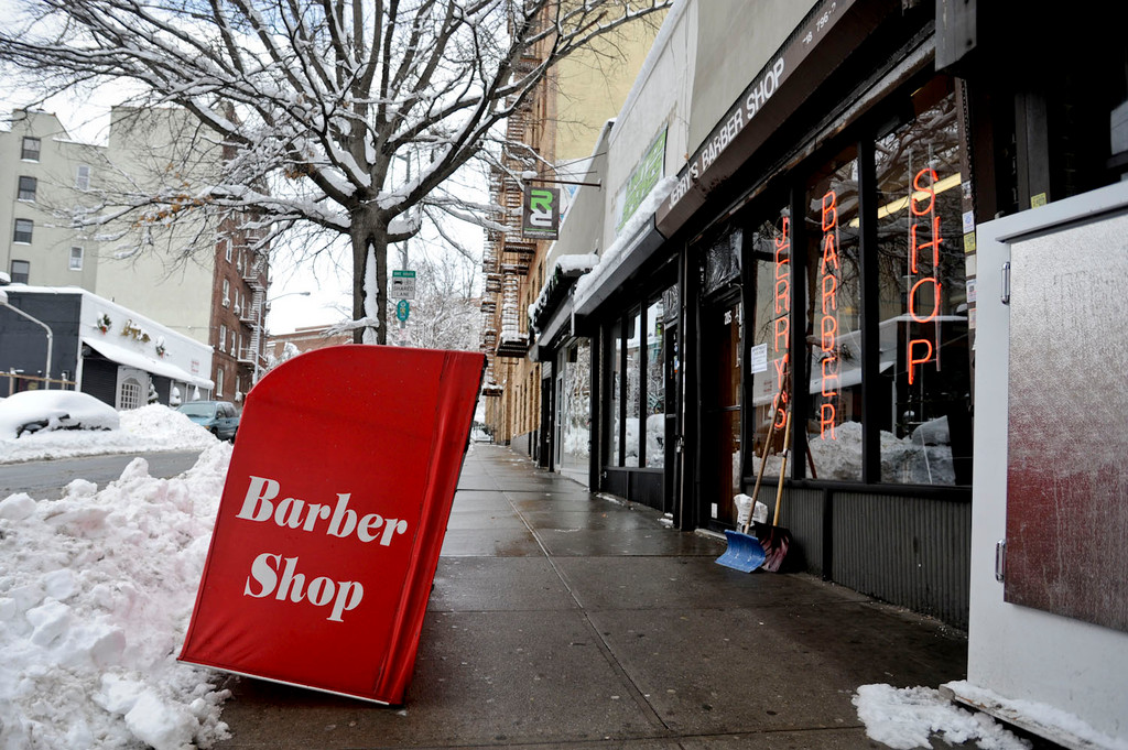 Heavy snow brought down the awning at Jerry's Barber Shop on Jan. 27. The shop is located on Manhattan College Parkway at Broadway.