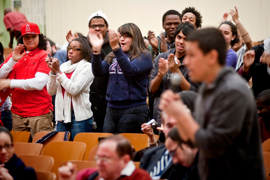 Students and advocates cheer in support of JFK alumnus Jeronimo Maradiaga, front at right.