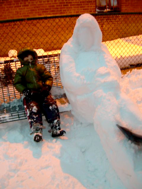 Julia Salleres captured this image of her son with a snow sculpture he and her husband built.