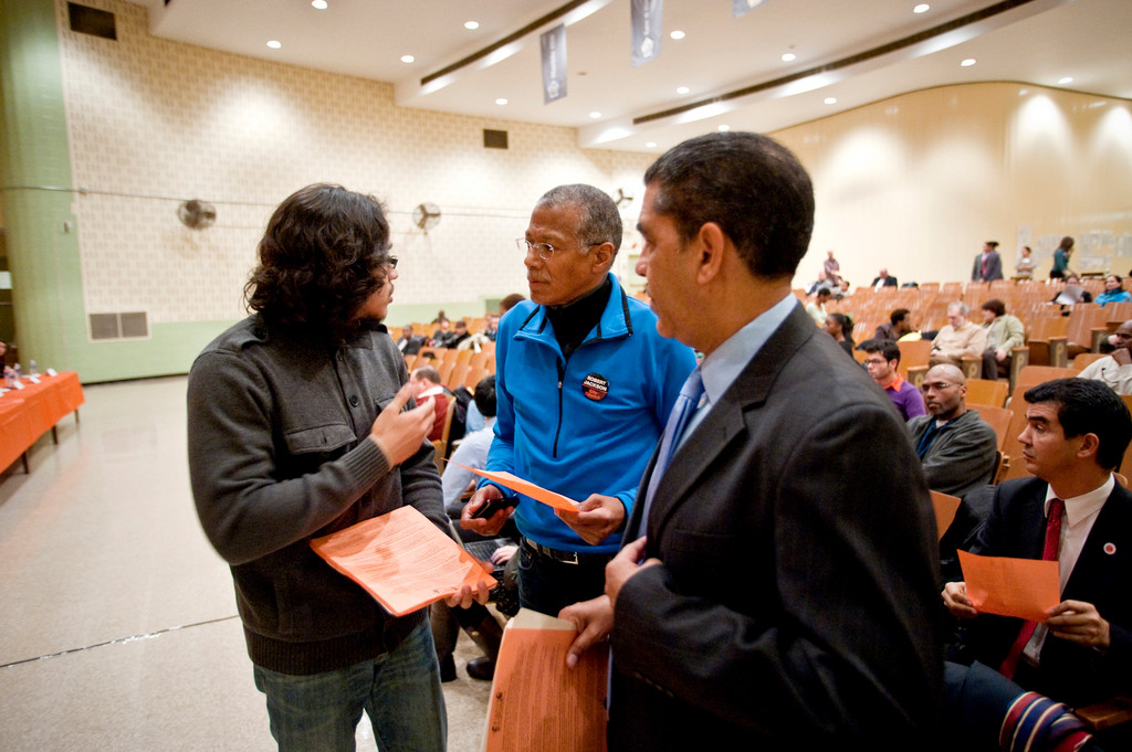 Rafael Pena, who graduated from Kennedy high school in 2007, standing at left, meets with District 7 council member Robert Jackson, center, and New York State Senator Adriano Espaillat, at right.