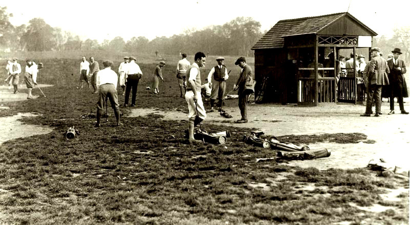 A historic photo shows golfers wielding their clubs on a course that is rustic at best.