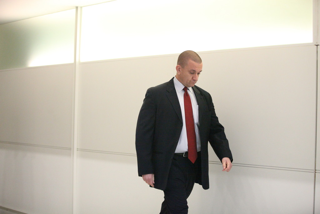 Detective Kevin Spellman arrives for the start of his trial at Bronx Criminal Court on November 21, 2011.
