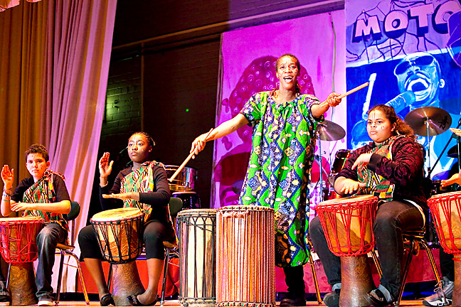 Gohoun Yobo, an African dance and drum teacher, leads Angel Lara Dixon, Fiona Sampany and Bryanna Marion, left to right, during ‘NSLA’s Journey to Motown’ show.