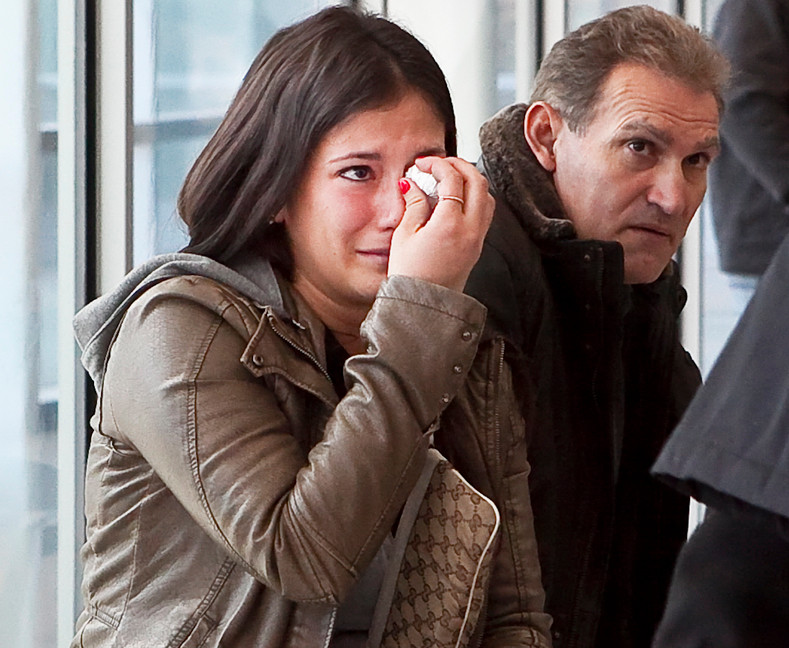 Lora Juncaj, 24, granddaughter of Drane Nikac, cries in the hallway after former NYPD Det. Kevin Spellman is given less than the maximum sentence.