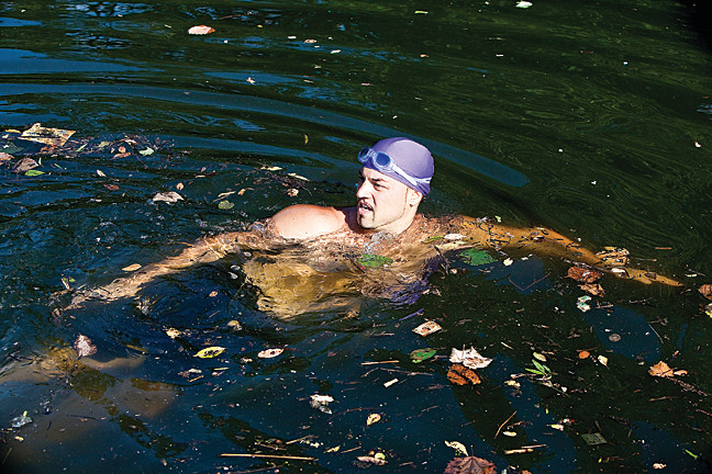 Baron Ambrosia was undaunted by pollution or floating debris as he paused near Starlight Park during his historic seven-hour Bronx River swim on Saturday.