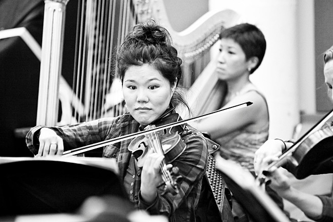 Violinist Susie Park rehearses with the Sinfonietta of Riverdale at Carroll Studios in Manhattan prior to a Riverdale Temple performance on Oct. 27, in which she served as concertmaster.
