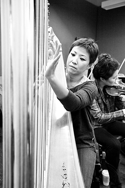 June Han displays mastery of the harp.