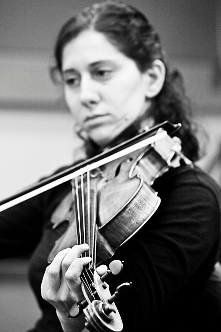 Eva Gerard concentrates on each note as she plays the viola.