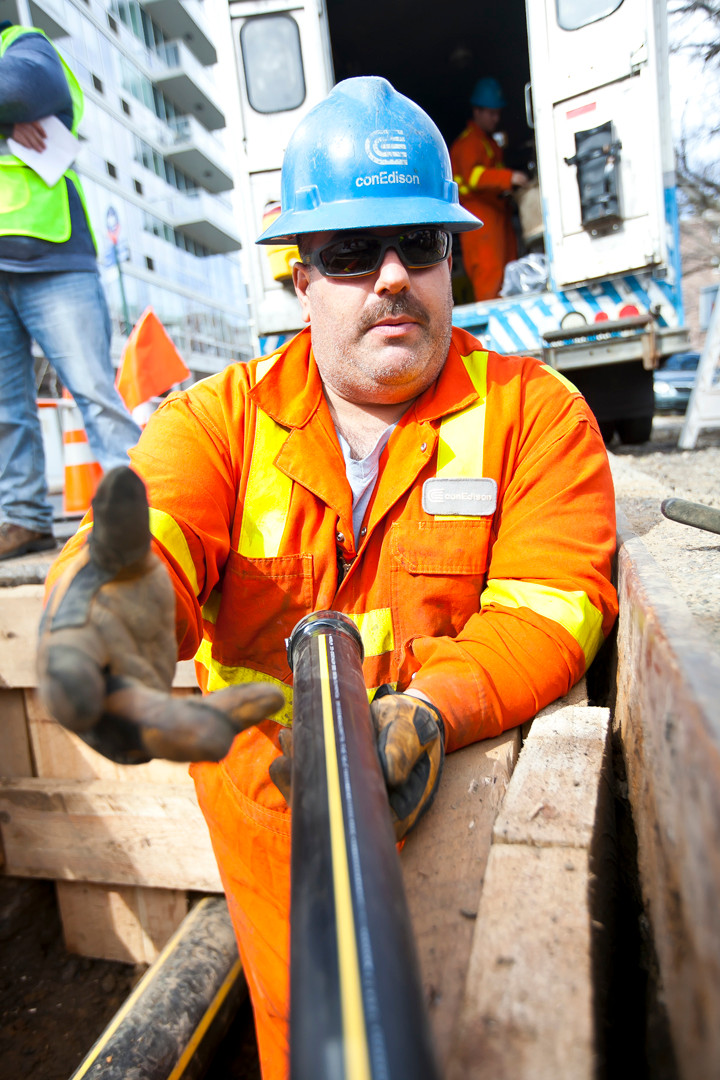 Mike Macario, an operation mechanic for Con Ed, holds a two-inch pipe that bring gas to 3611 Henry Hudson Parkway.