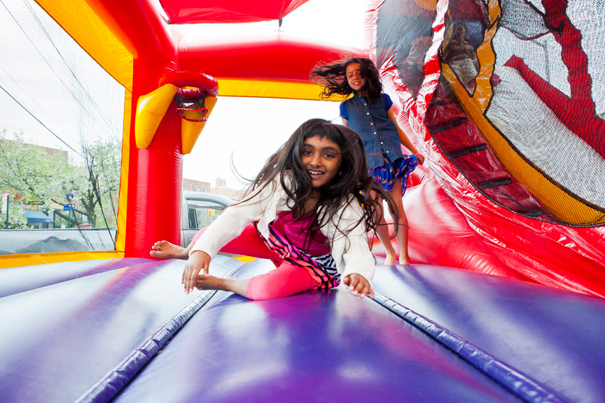 Natasha Thaha, 8, and Hailey Mayi, 10, spend time on an air bounce.