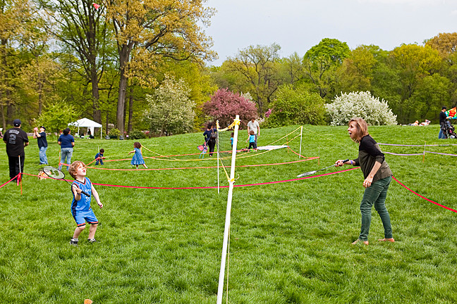 Norma Irom and her grandson Raphael Irom, 6, play a hand of Badminton on Daffodil Hill at The New York Botanical Gardens as part of the Mother’s Day Weekend Garden Party on Saturday.