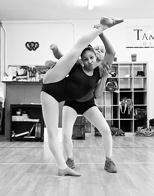 Tamiko Maldonado the owner of TamiCo. Dancing, helps Melany Blanco, 13, with her moves.