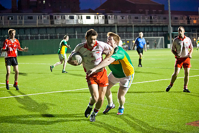 Joe Bell, in white, for Tyrone, keeps the ball away from Luke Barret, for St. Barnabas, at Gaelic Park. Find out how the Gaelic Football season is going,