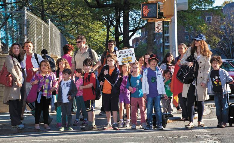 Students and parents flood the corner of 236th Street and Independent Ave on Walk to School Day in April 2012.