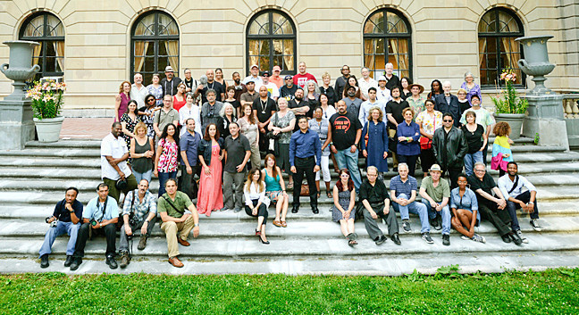 Participants in the Bronx Artist Documentary Project pose in front of the Andrew Freedman House, photographed by  Viorel Florescu