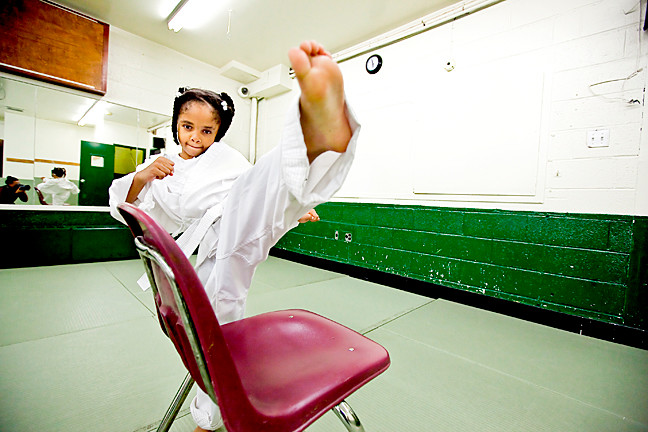 Leila Hawkins, 7, works on her kicking technique.