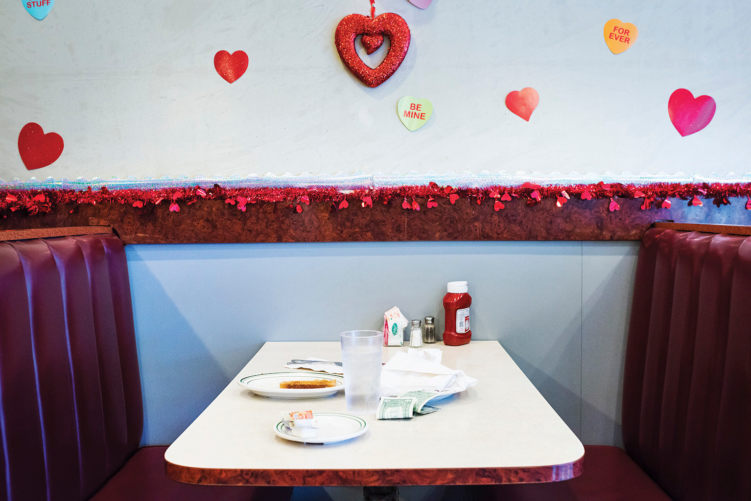 Customers leave a tip on a table in Louie's Dale Diner on Monday