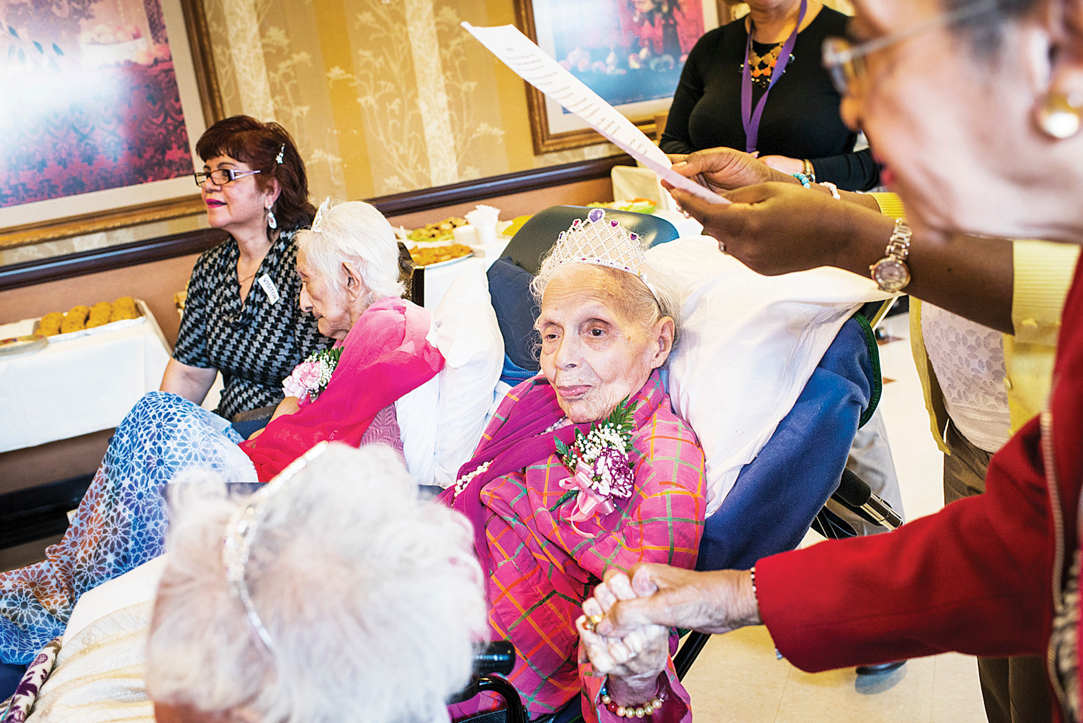 Bernice King, 108, listens to a family statement during a birthday party.