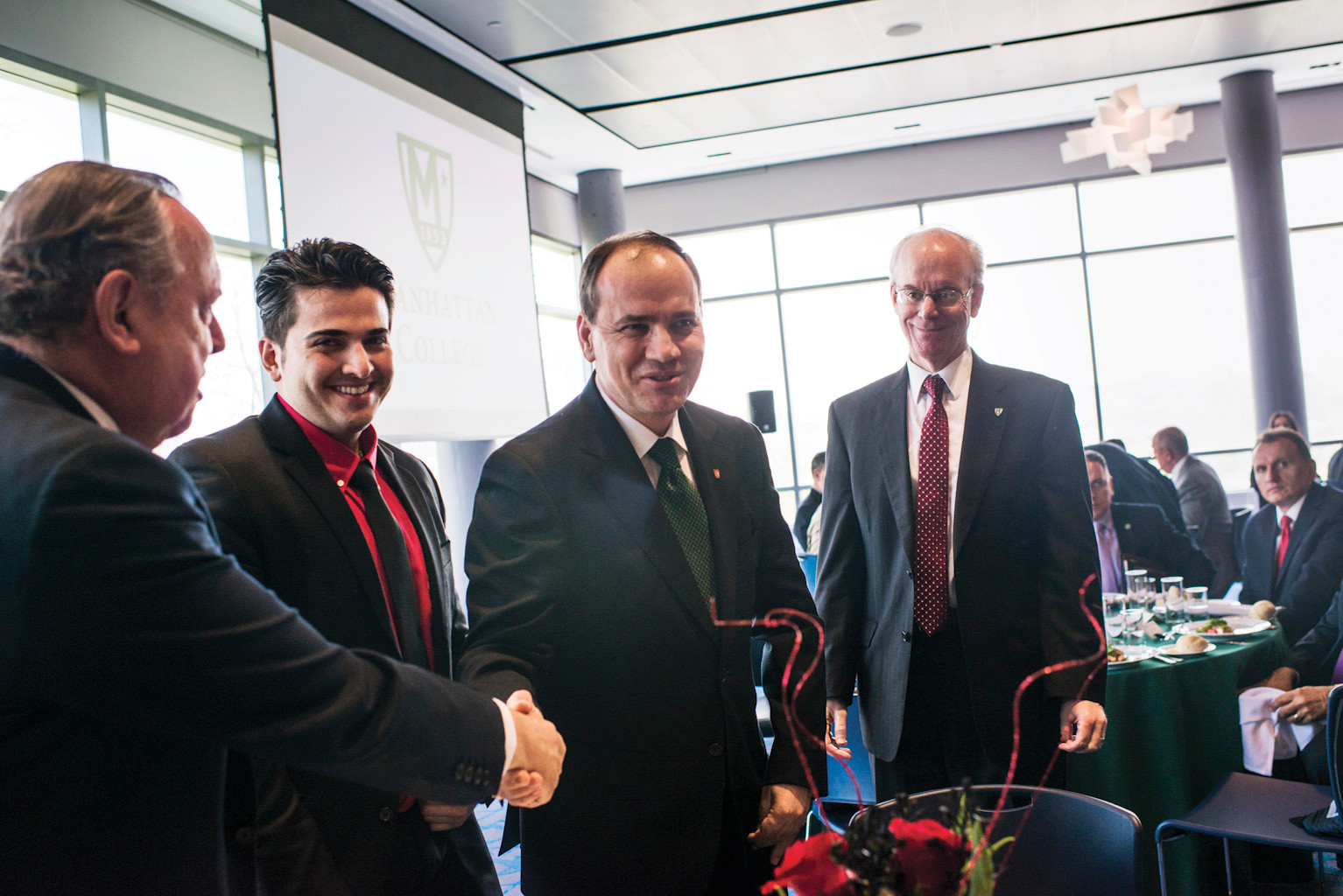 Albanian President Bujar Nishani greets members of the Manhattan College board in the Kelly Commons on May 7.