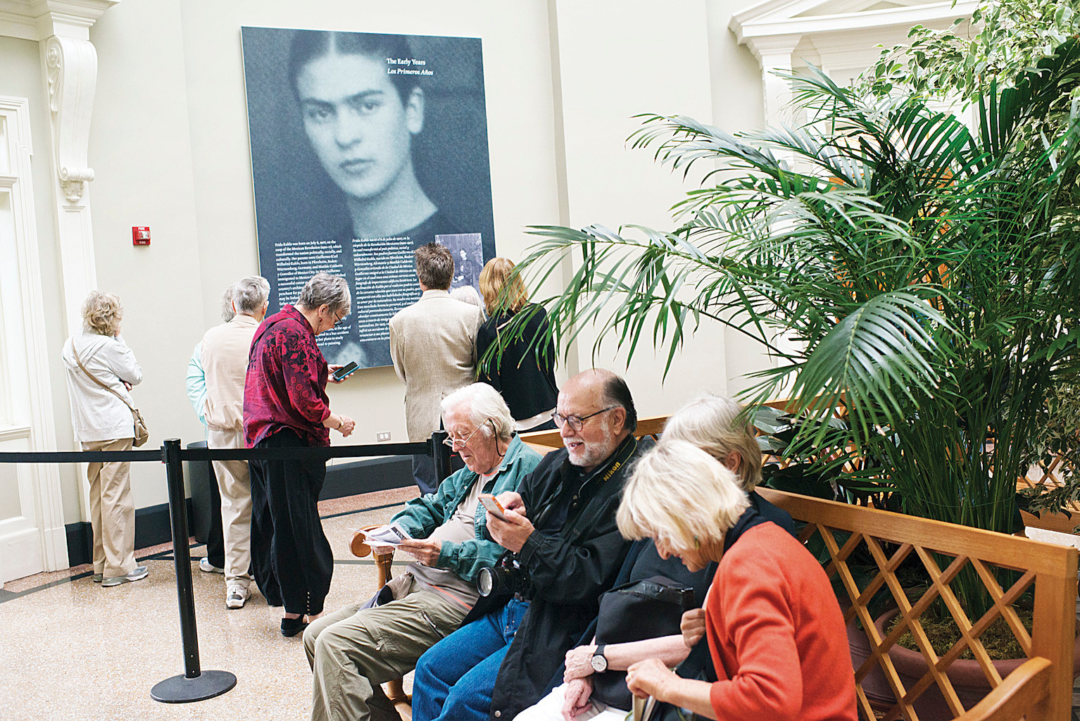 NYBG members take a seat to rest as the Frida Kahlo show spans the entire garden, from the conservatory to the rotunda building to the food on offer in the cantina - employees at the opening on may 15 described it as one of the biggest ever exhibitions for the institution.
