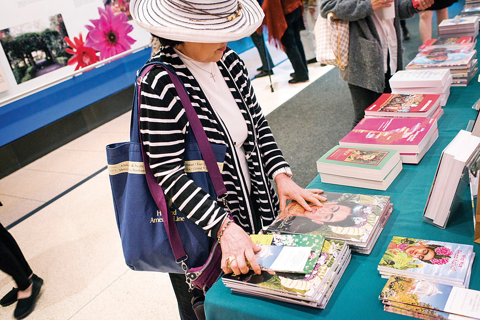 New York Botanical Garden members view the Frida Kahlo books for sale before a panel discussion on Mexican Art in the Ross Auditorium.