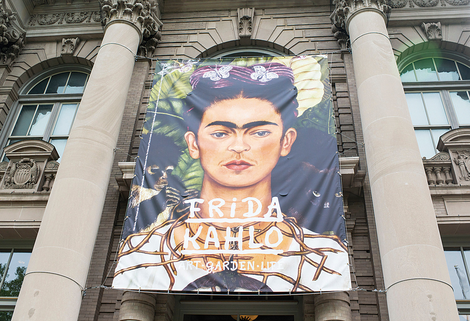 A large Frida Kahlo print hangs over the Britton Rotunda entrance.