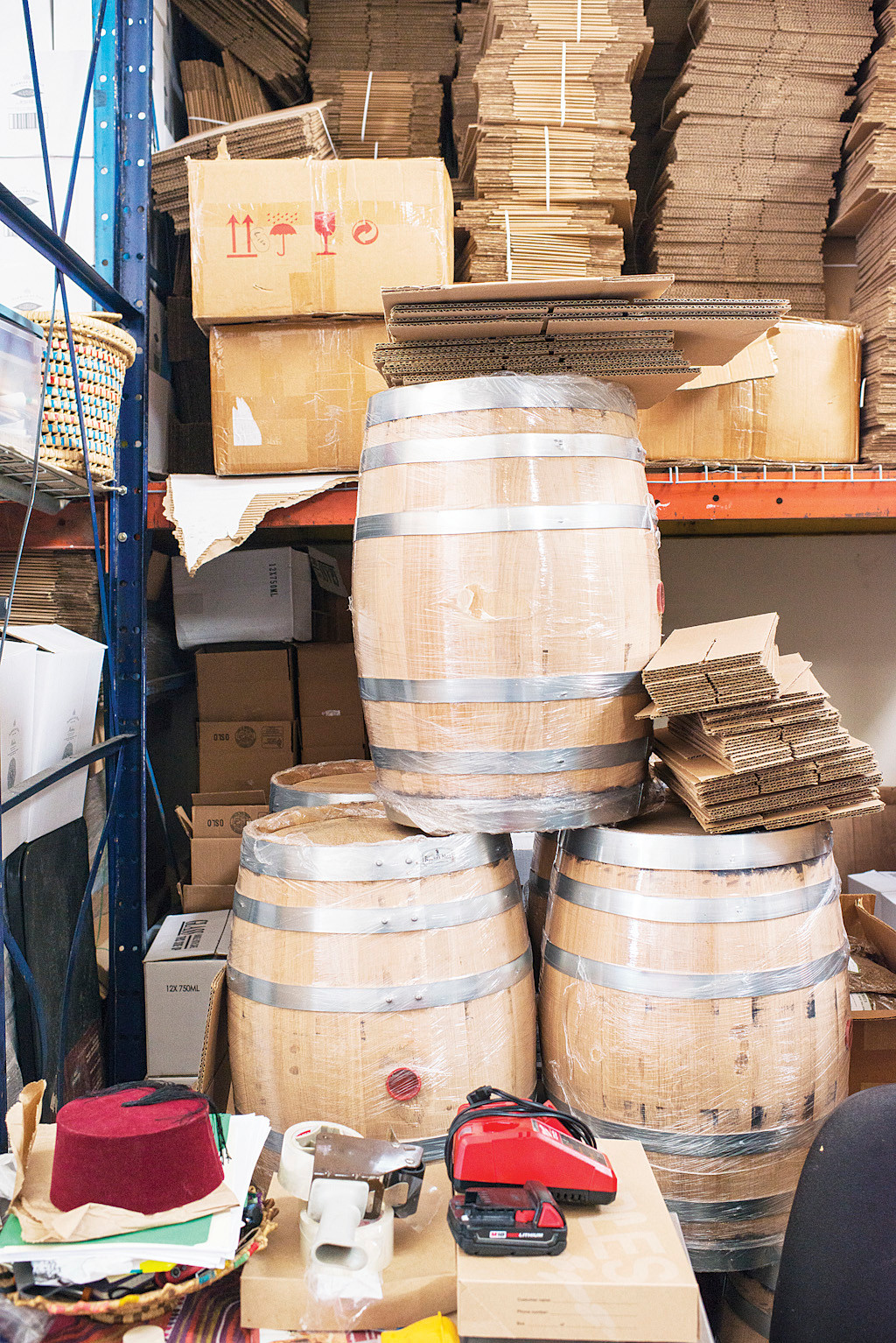 Empty bottles and casks wait to be filled with whiskey for aging.