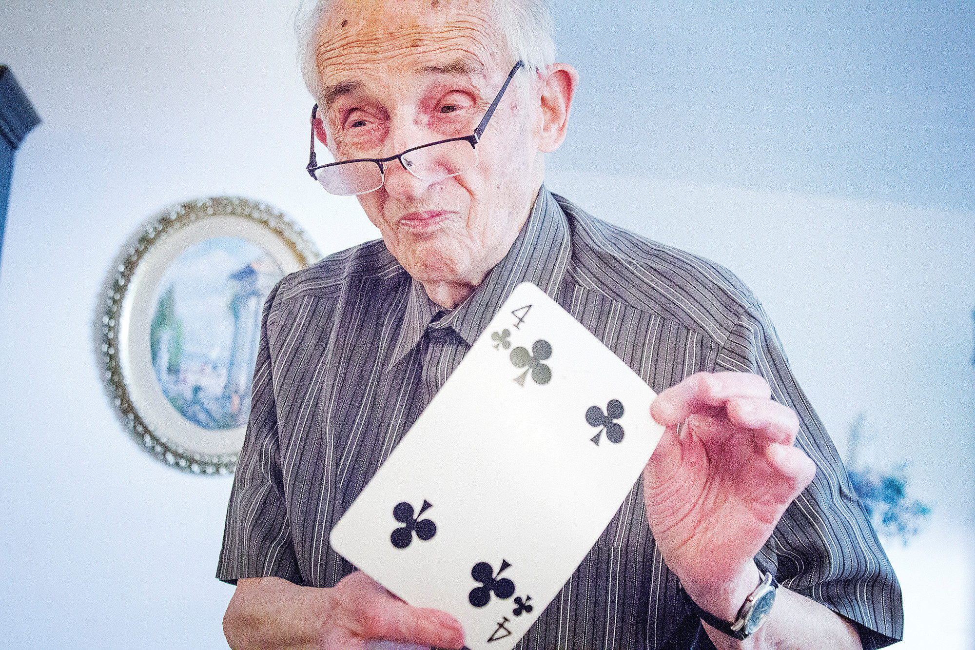 Jerry Oppenheimer, 93, the Society of American Magicians' Magician of the Year, demonstrates one of his card tricks at his home on June 19.