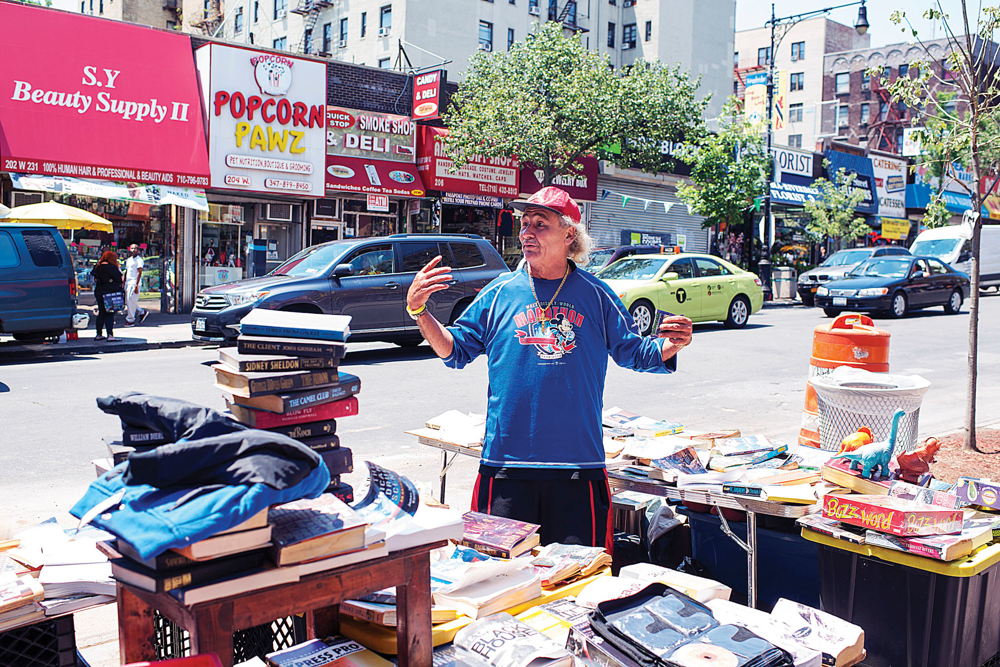 Vendor Peter Diego, 49, next to his book stand on West 231st Street.
