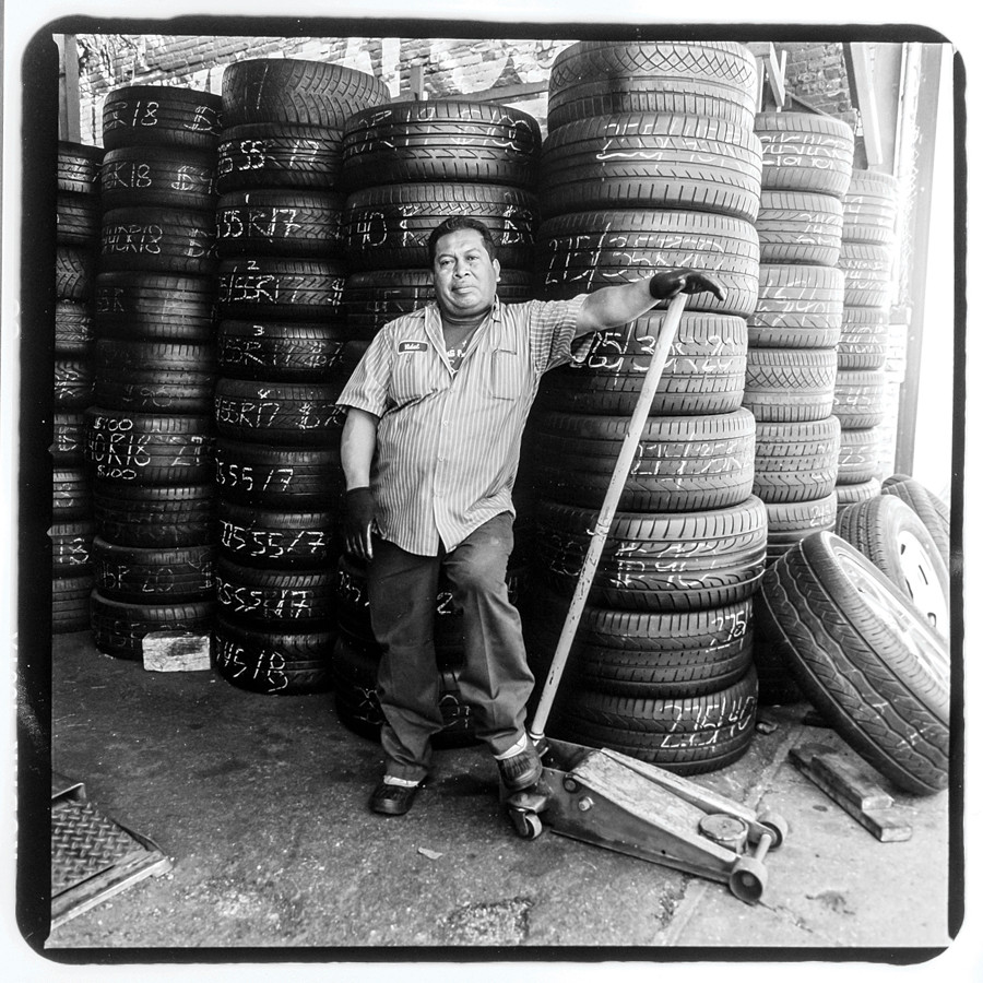 Josè Cruz, a mechanic at Diffo Auto Glass & Flat Fix, 1510 Jerome Avenue. Josè has been working on Jerome Avenue for 25 years--he fled the civil war in his native El Salvador in 1990.