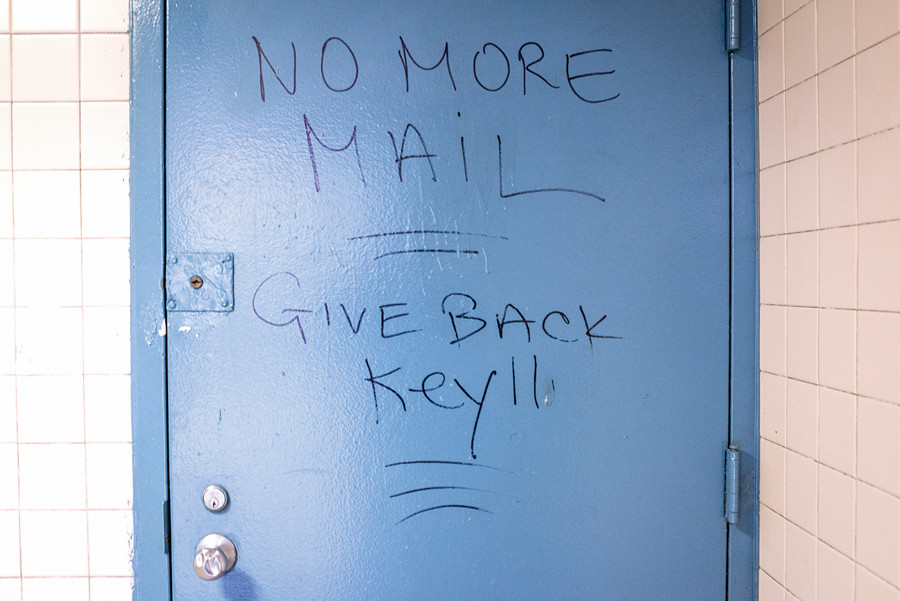 A note scrawled on the door to the mail room in the Fort Independence Houses, which recently has had no mail delivery after the keys to the mail room were stolen, seen on Oct. 1.