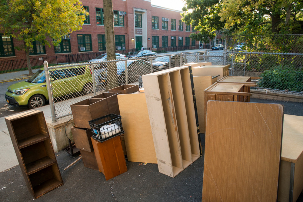 Teachers' desks from the Spuyten Duyvil School (P.S. 24) stacked in a recycling area by the school on Oct. 15. All of the desks have since been returned.