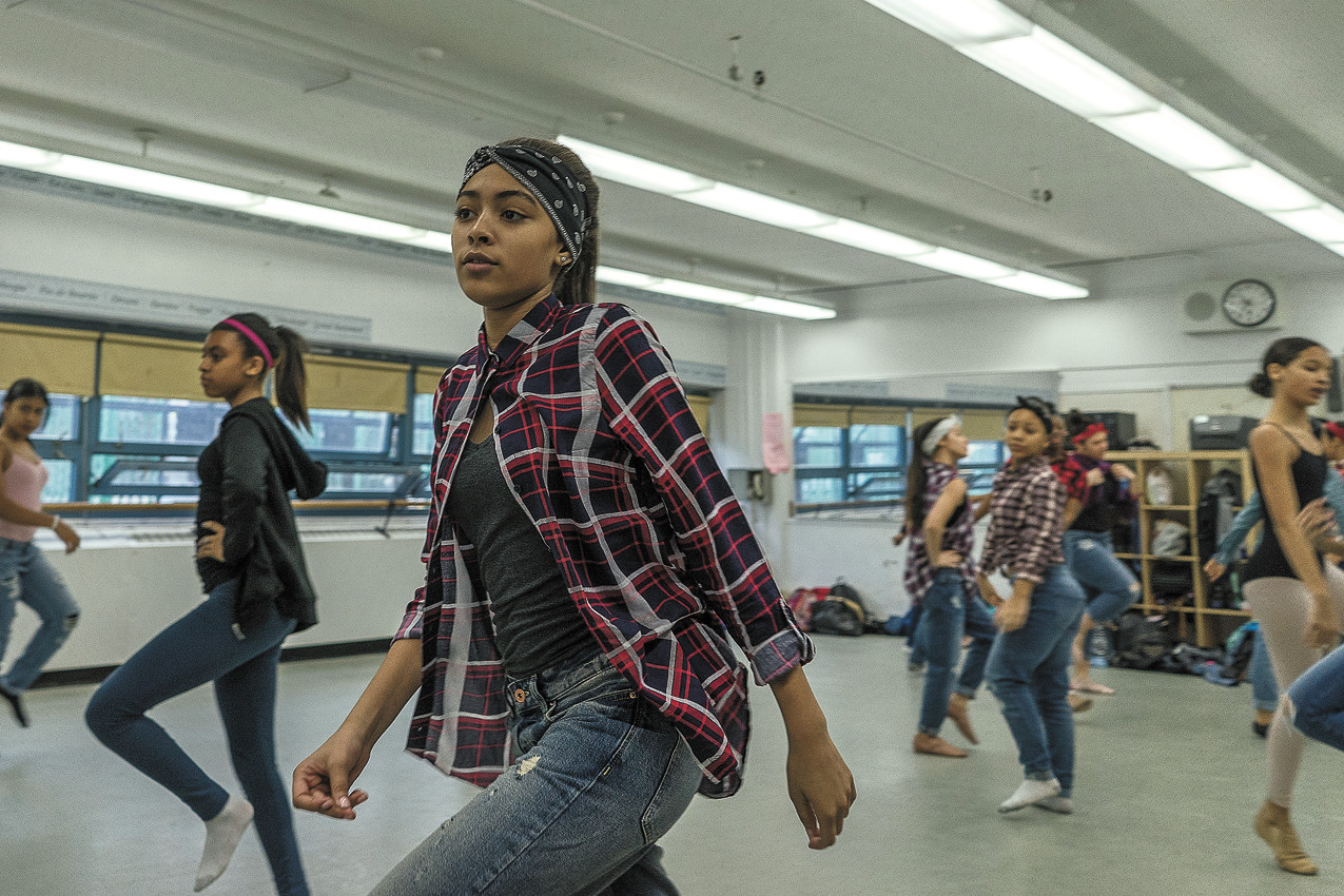 Eighth grader Destiny Vallejo rehearses on Feb. 25 for the ‘Celebration of African American Women Concert’ at the New School for Leadership and the Arts. Below, Damien Stallings, also in eighth grade, practices a break-dance routine.