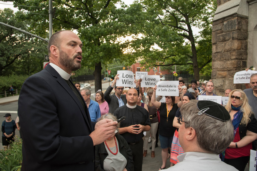 Rev. Andrew Butler of Christ Church Riverdale urges passage of stricter gun control laws at a June 15 vigil for victims of the Orlando attack at Riverdale Monument.