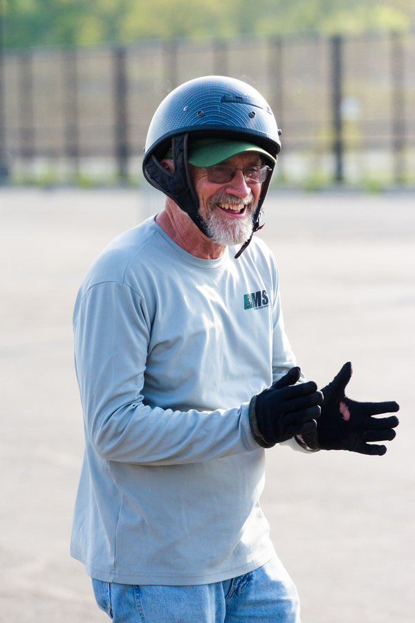 Instructor and motorcycle guru Jimmy Walsh applauds his students at Lehman College.