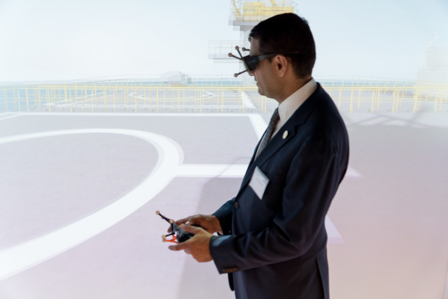 Lehman College president José Cruz experiences virtual reality in the Eon’s Reality Icube. Visitors could experience virtual reality first-hand as they are transported to a rollercoaster ride or walk on an oilrig stationed in the middle of the ocean. The school, in collaboration with Eon Reality, launched a Virtual Reality and Training and Development Lab and an 11-month non-credit course, which includes animation and web design.