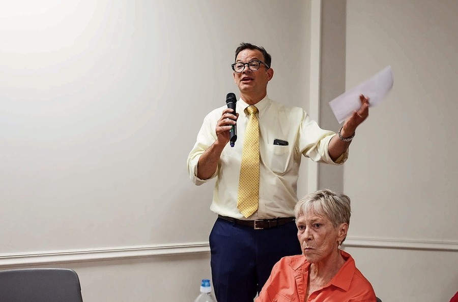 Councilman Andrew Cohen speaks to Community Board 8 members against the creation of a homeless shelter in a recently constructed apartment building at 5731 Broadway. Some community members say the shelter was planned without community involvement.