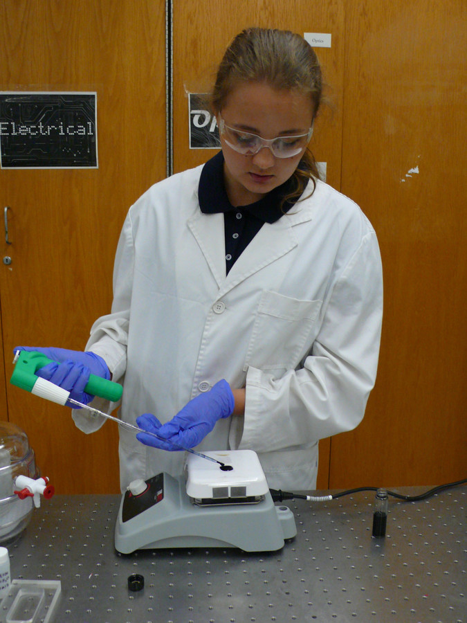 Vera Zarubin, working in a lab at Queens College, demonstrated how to convert heat waste into electricity.