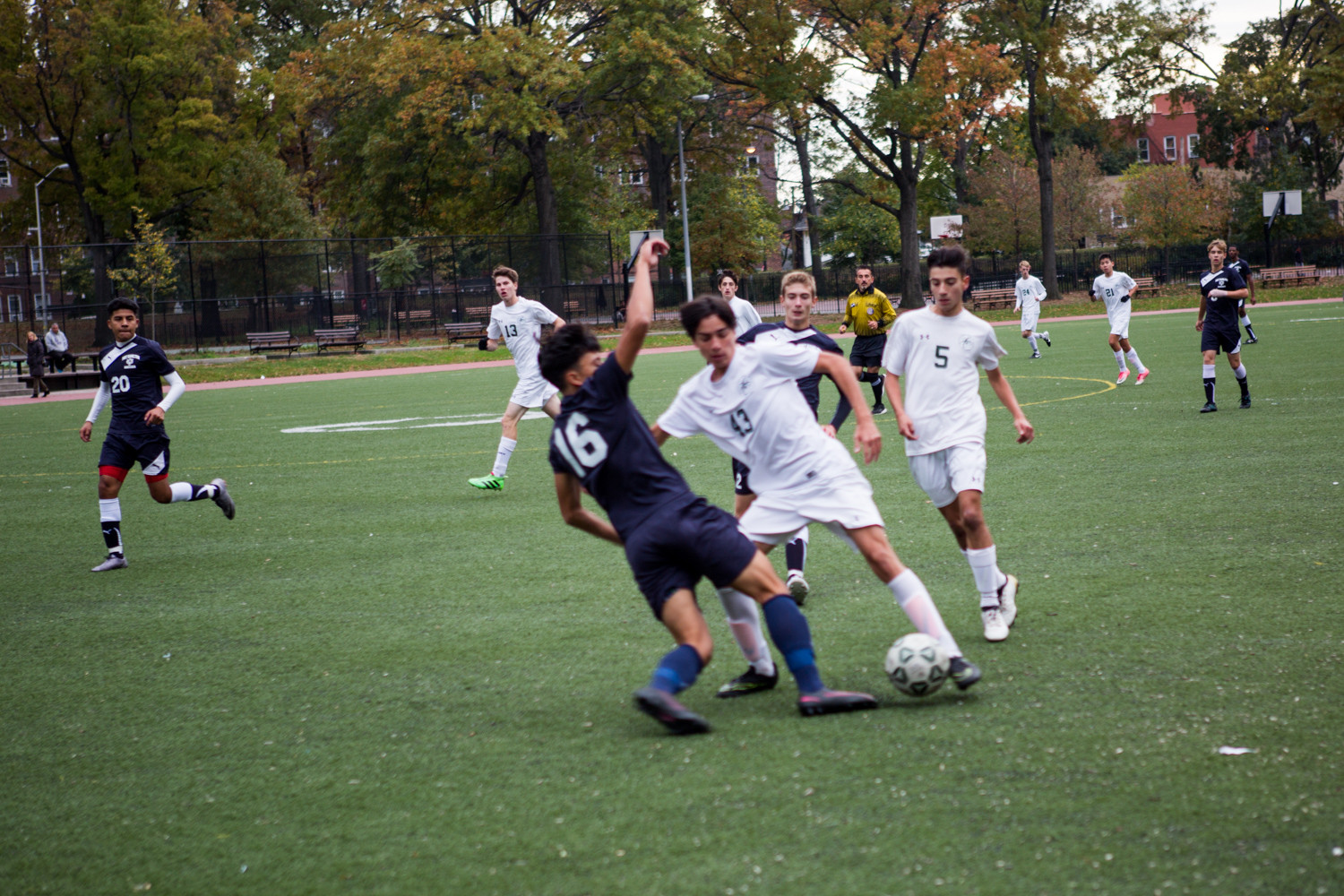 Bronx Science’s Mikael Young Malka (43) tries to get around Fort Hamilton defender Jonathan Granados during the Wolverines’ 2-0 playoff loss last week.